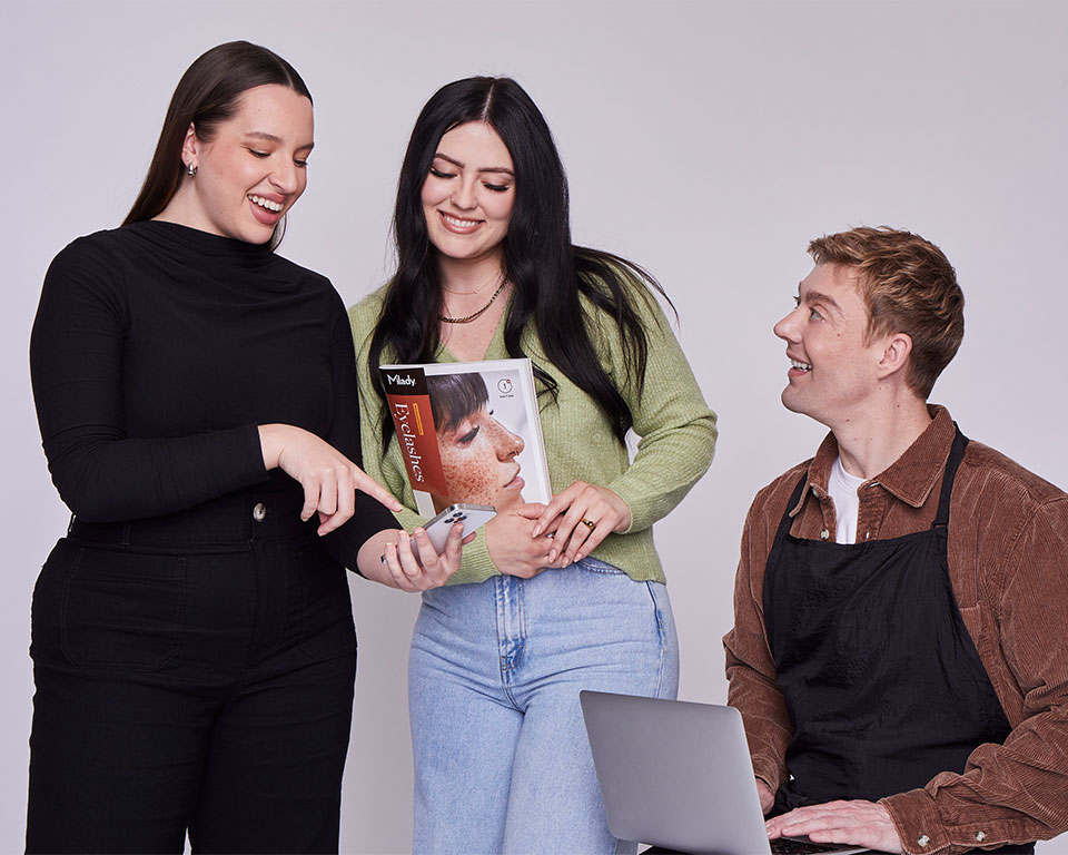 beauty school students looking at Milady products